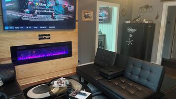 Smart TV, fireplace, books