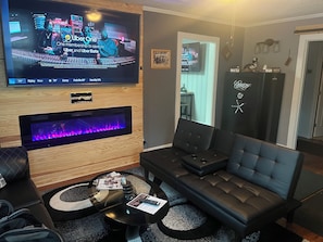 Smart TV, fireplace, books