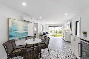 55-inch flat-screen TV with cable channels, TV