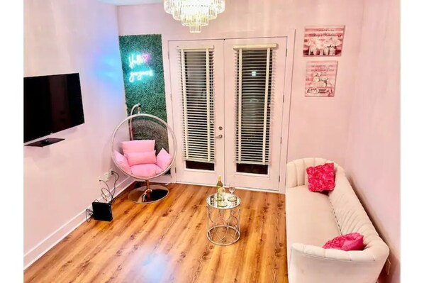 Relax in this stylish living room with a sofa, armchair, and coffee table, perfect for unwinding.