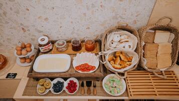 A breakfast buffet with various food items and condiments.