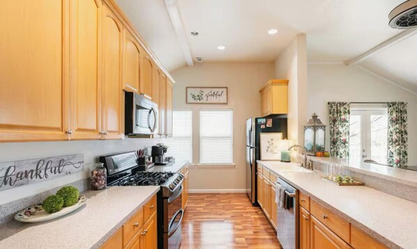 A bright and airy kitchen with ample counter space and a large walk-in Butler's pantry.