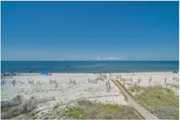 Guests can enjoy access to the beach via a boardwalk.