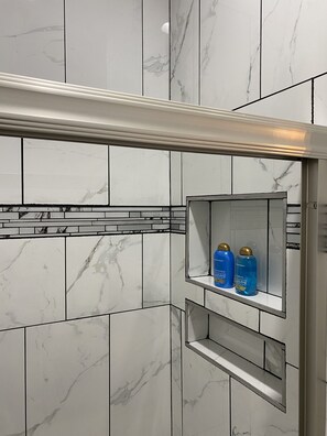 Shower, towels, soap, toilet paper