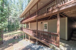 A two-story wooden cabin with a balcony, surrounded by a forest. - WALK TO LAKEMONT PINES LAKE AND ARNOLD RIM TRAIL W/AIR CONDITIONING (Arnold)