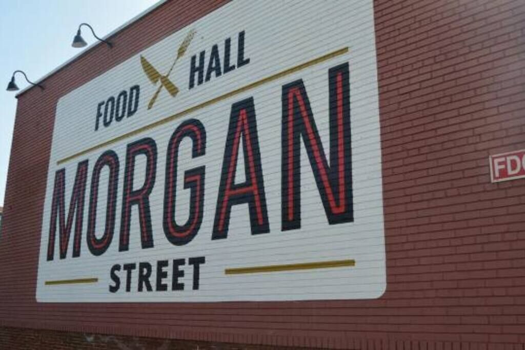 A sign for 'Food Hall Morgan Street' on a brick building.