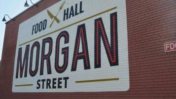 A sign for 'Food Hall Morgan Street' on a brick building.