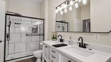 Bathtub, eco-friendly toiletries, hair dryer, towels