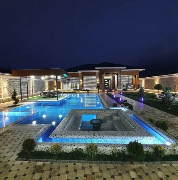 Enjoy a refreshing swim in the resort's rectangular pool surrounded by a tiled deck.