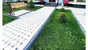 A house with a tiled patio, a swing chair, and a small garden. - Villa "Ustoz" in Chorvoq, Tashkent (Тошкент)