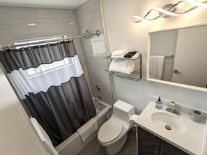 Hair dryer, towels, soap, shampoo