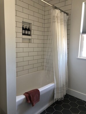 Combined shower/tub, hair dryer, towels, soap