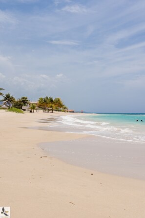 Private beach nearby, white sand, free beach cabanas, beach bar