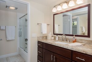 Combined shower/tub, hair dryer, towels, soap
