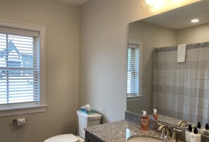 Combined shower/tub, towels, toilet paper