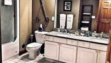 Bathtub, jetted tub, towels, soap