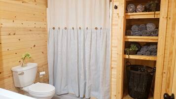 Bathtub, hair dryer, towels, soap