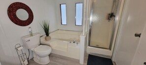 Bathtub, hair dryer, towels, soap