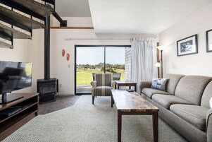 Traditional Townhome | Living area | 32-inch flat-screen TV with cable channels, TV, fireplace