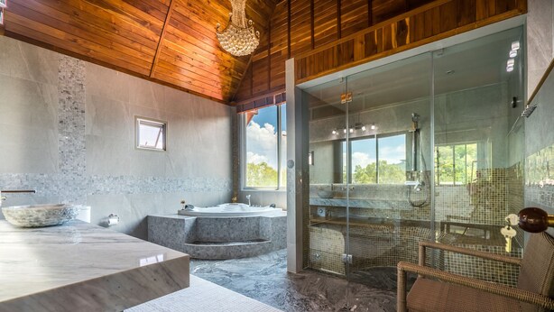 A modern bathroom with a large bathtub, a glass-enclosed shower, and a wooden ceiling. - Exclusive Villa Stan with Top Amenities (Kamala)