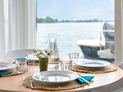 Modern houseboat with air conditioning in port