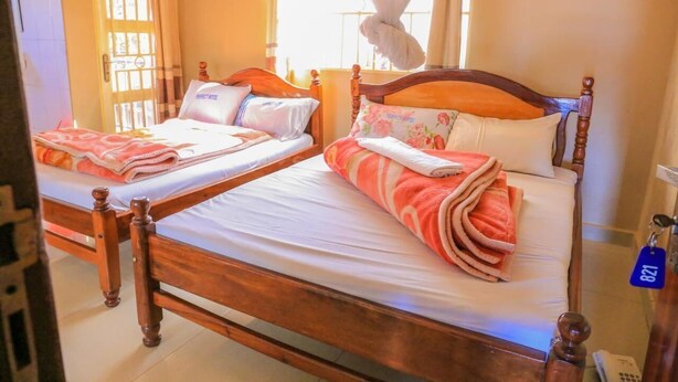Twin Room | Blackout drapes, WiFi (free), bed sheets - Precise Hotel (Kampala)