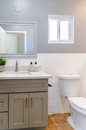Combined shower/tub, hair dryer, towels, soap