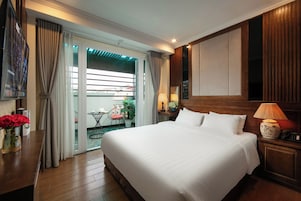 Deluxe Room, 1 Bedroom, City View | Minibar, desk, laptop workspace, blackout drapes