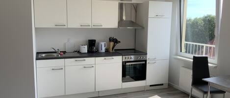 Comfort Apartment | Private kitchen | Full-size fridge, oven, stovetop, dishwasher