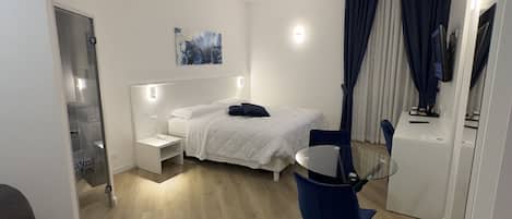 Premium bedding, down comforters, free minibar items, in-room safe