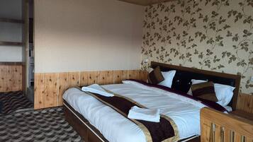 A room with a wooden bed, a checkered floor, and a floral wallpaper.
