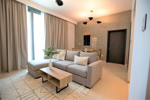 Apartment (1 Bedroom) | Living area | 1-cm plasma TV with satellite channels, TV - Luxurious Downtown Views With Dubai Mall Access (Dubai)