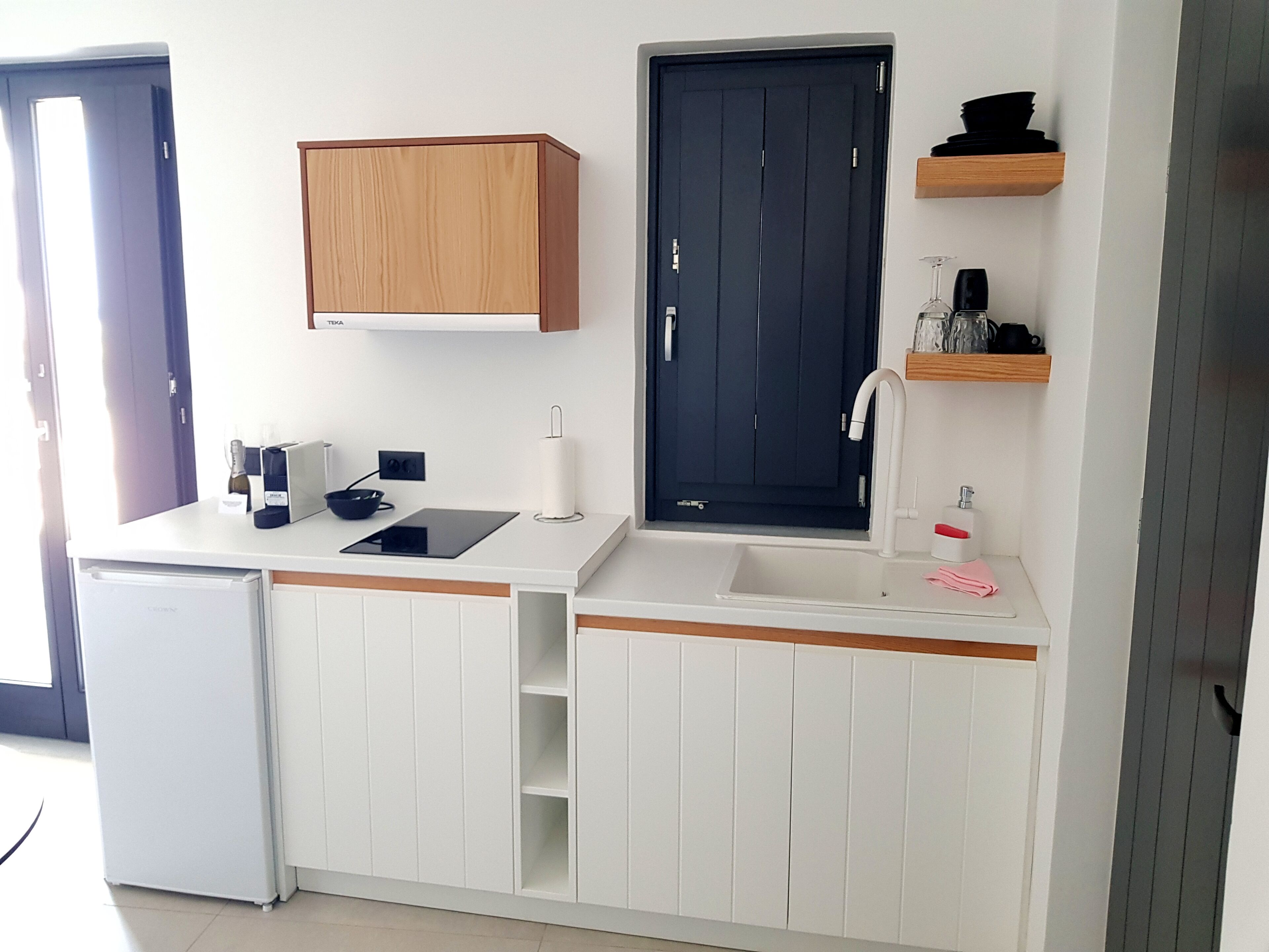 mini-fridge, microwave, stovetop, espresso maker