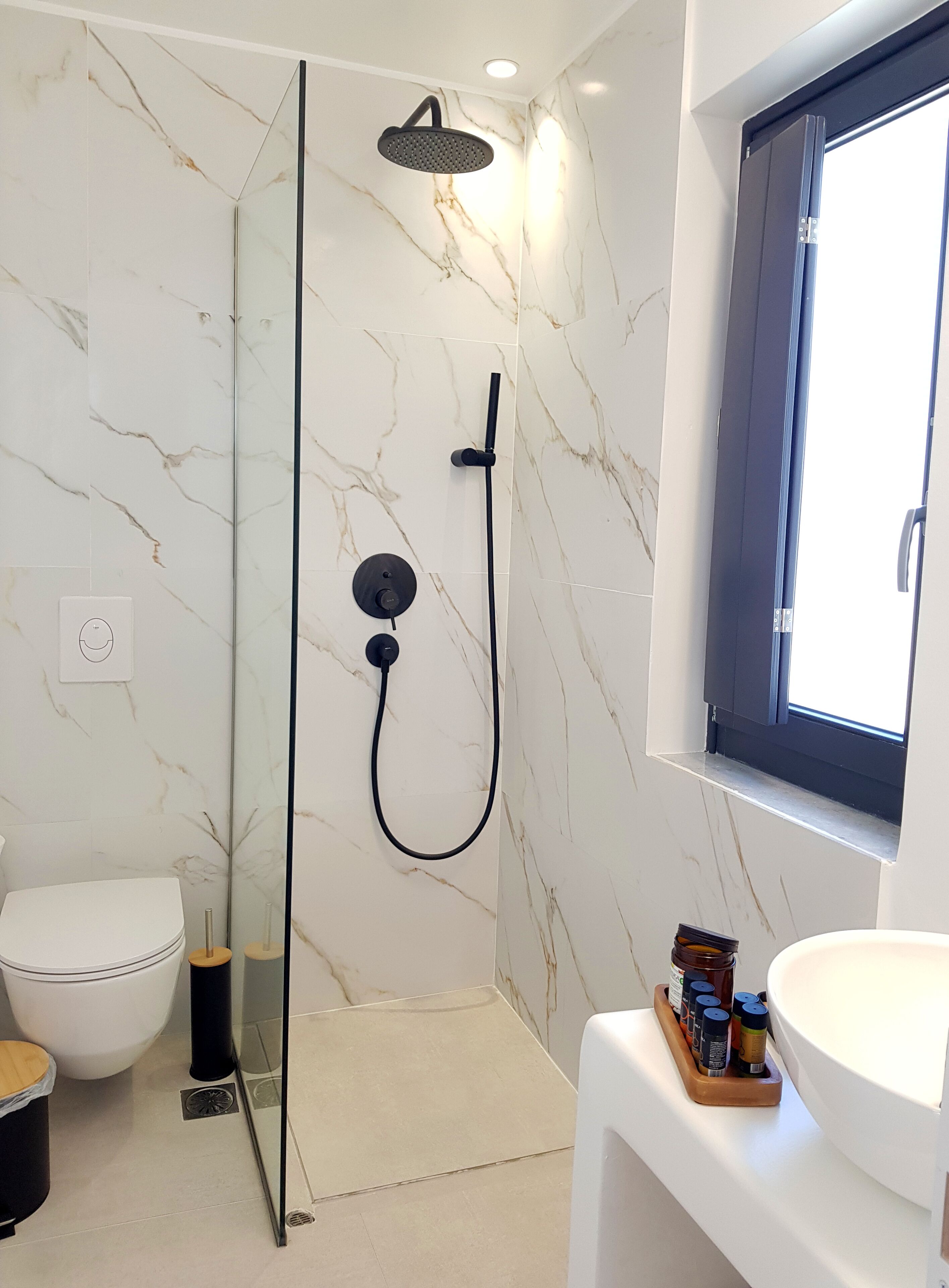 junior studio suite | bathroom | shower, rainfall showerhead, hair dryer, slippers