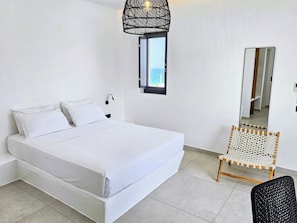 Junior Studio Suite | Premium bedding, in-room safe, blackout drapes, soundproofing - myLithos Suites (Santorini)
