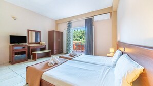 A hotel room with a bed, a desk, a TV, a wardrobe, and a balcony with a view. - Studio Apartment 'Arianna Superior Studio 19' with Shared Pool & Wi-Fi (Corfu)