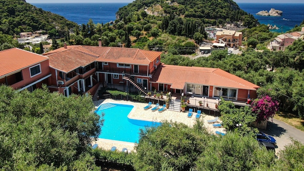 A hotel with a swimming pool, terraced balconies, and views of the sea. - Studio Apartment 'Arianna Superior Studio 19' with Shared Pool & Wi-Fi (Corfu)