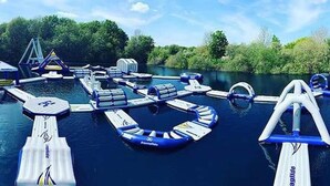 A water park with various water play structures and inflatable rafts. - Impeccable 3-bed Cabin in Tattershall, UK (Lincoln)