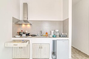 Fridge, coffee/tea maker, electric kettle, toaster