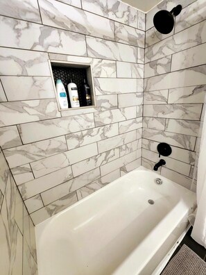 Combined shower/tub, hair dryer, towels, soap