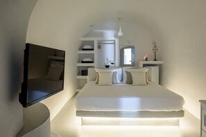 Suíte executiva | Ferros/tábuas de passar roupa, Wi-Fi de cortesia, roupa de cama