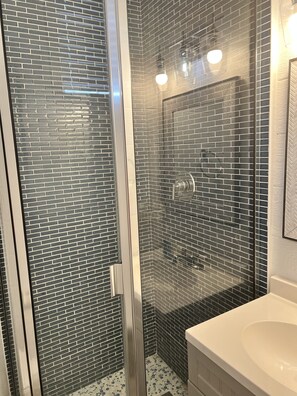 Shower, hair dryer, towels, soap