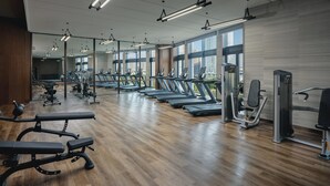 A gym with treadmills, weight machines, and benches. - Holiday Inn Hotel and Suites Kunshan Huaqiao by IHG (Suzhou)