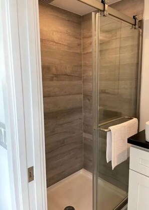 Shower, towels, soap, toilet paper