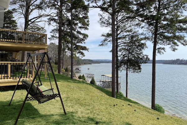 Swing in backyard facing the lake, rear deck in background
