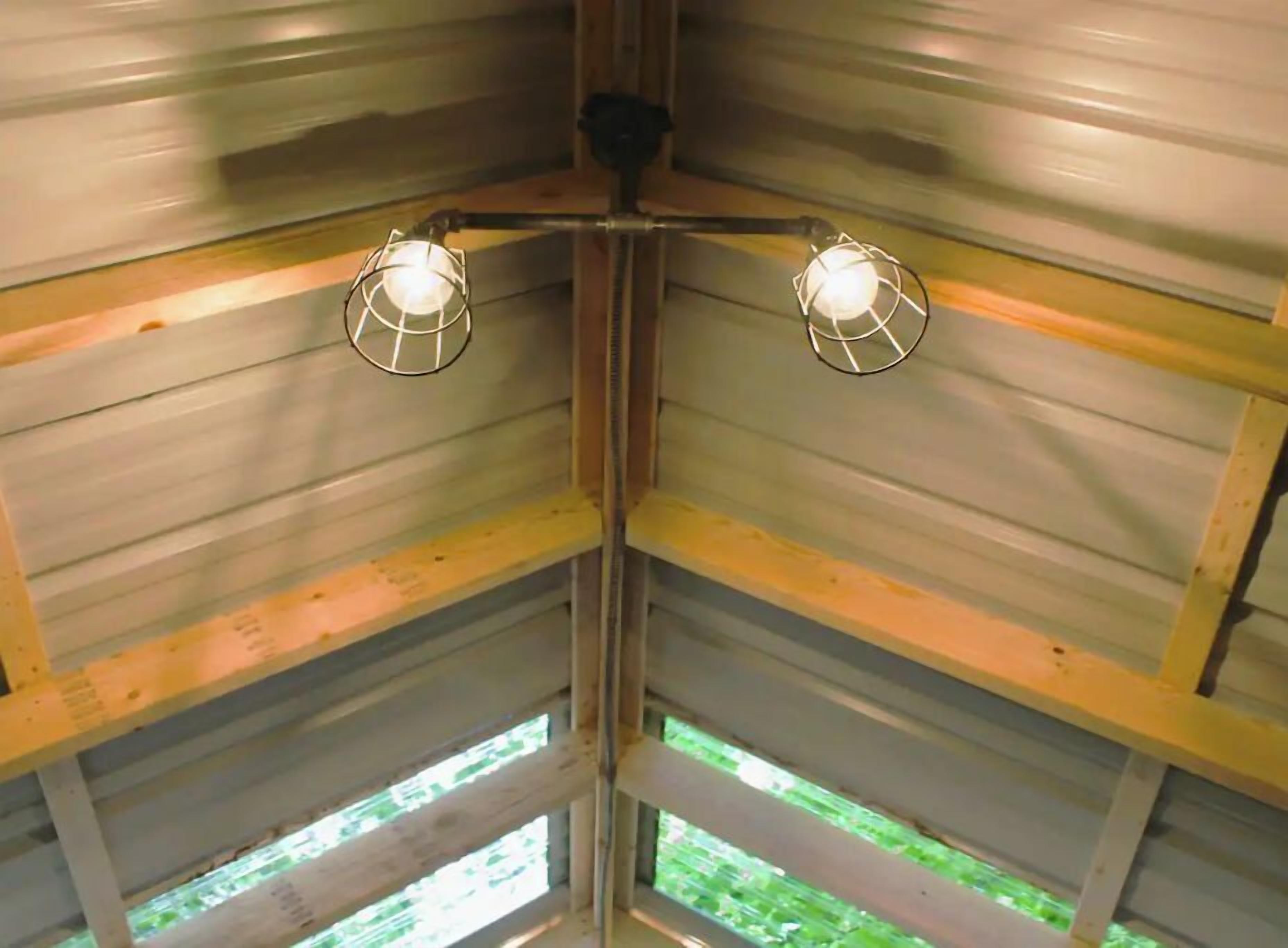 A corner of a room with metal walls and a wooden beam structure.