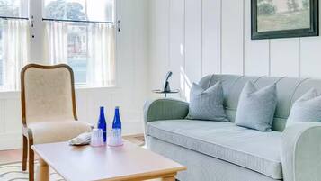 Traditional Suite | Living area | 55-inch Smart TV with cable channels, TV, Netflix