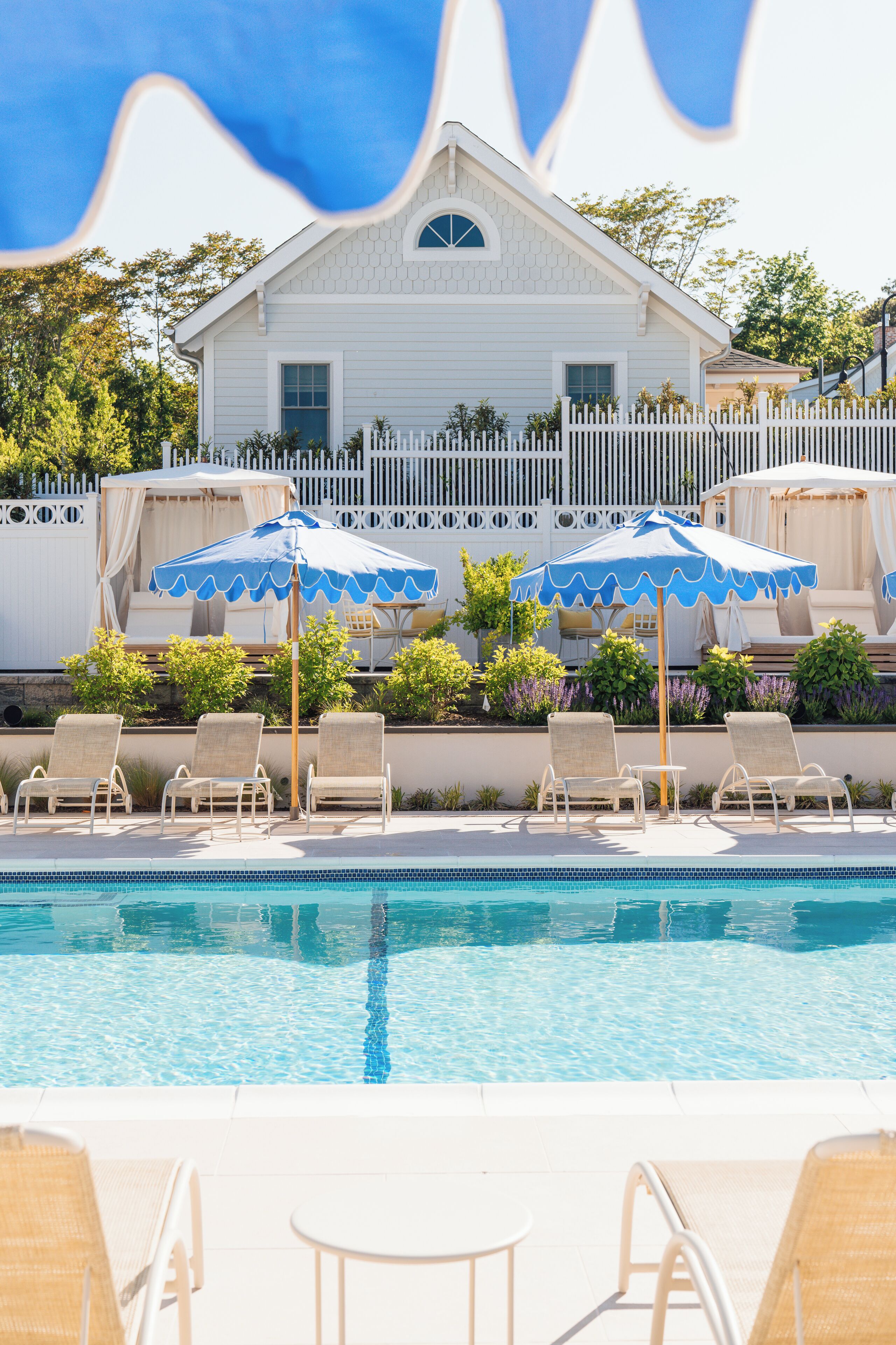 Seasonal outdoor pool, open 8:00 AM to 8:00 PM, pool umbrellas