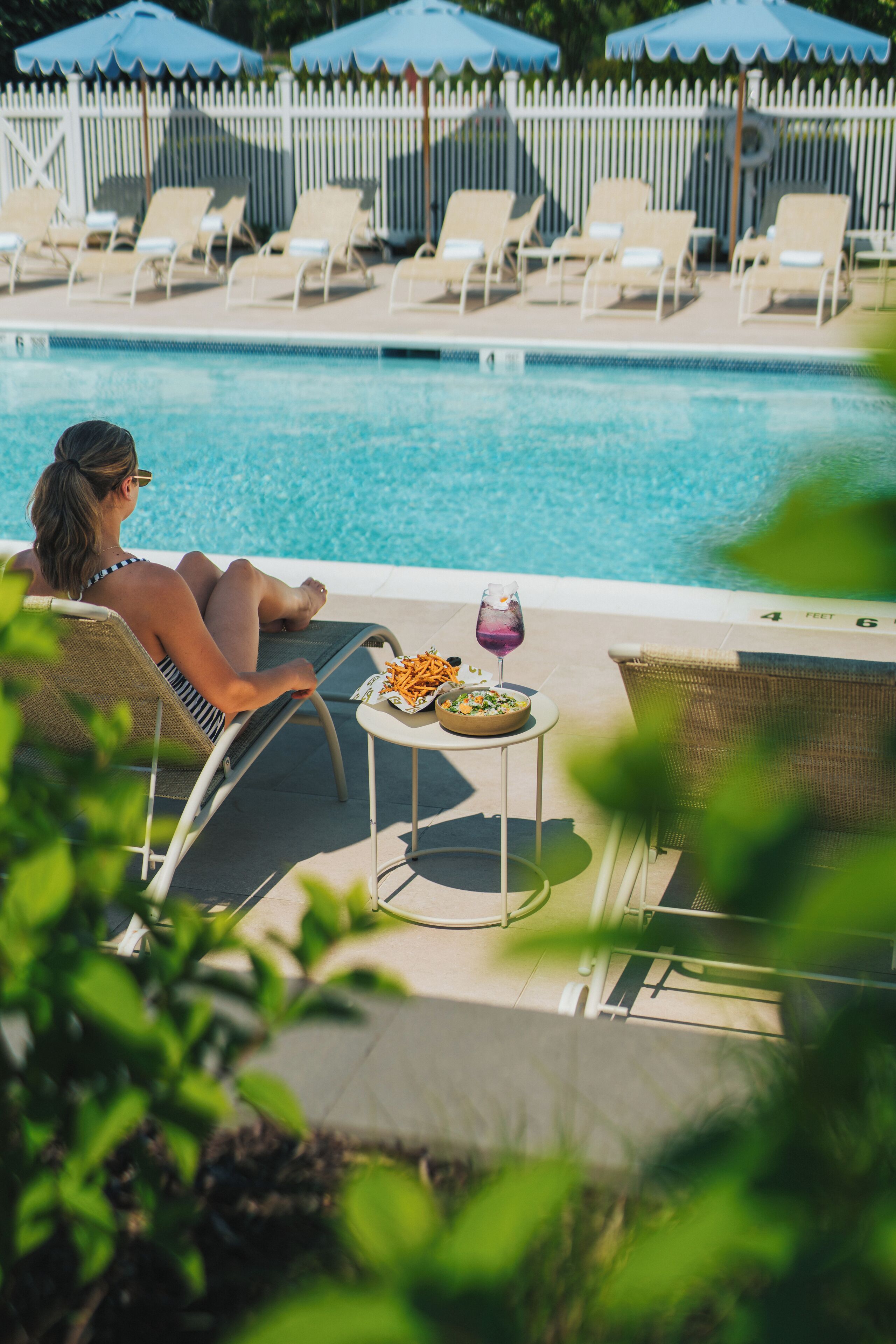 Seasonal outdoor pool, open 8:00 AM to 8:00 PM, pool umbrellas