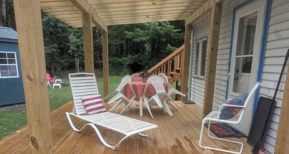 cottage surrounded by field and woods, walking distance to beach